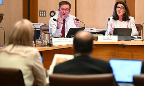 Liberal Senators Jane Hume and James McGrath speak during Senate estimates.