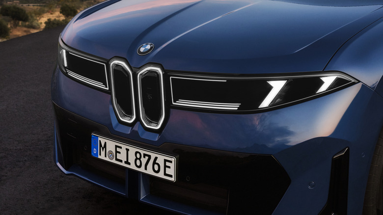 Headlights and front end of a blue 2026 BMW iX3