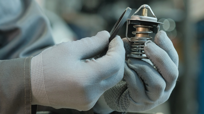 A car's thermostat, which play a key role in bleeding excess air from the cooling system.